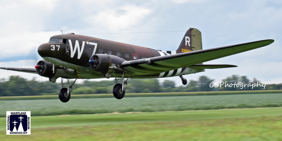 Image of 'Whisky 7' Just after take-off few feet above the ground. Field in the background