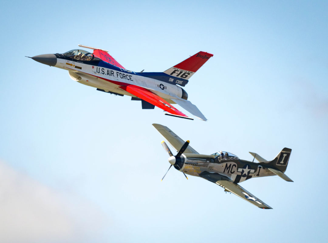 U.S. Air Force F-16 Fighting Falcon and P-51 Mustang fly together during a Heritage Flight.
